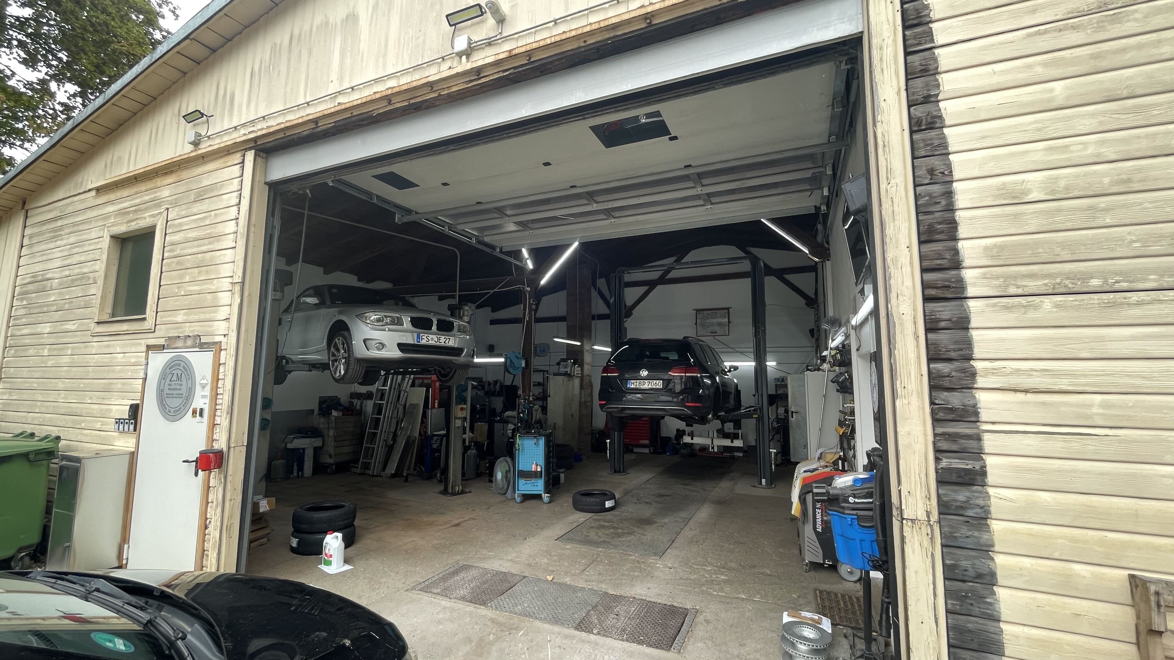Z.M. workshop with cars on vehicle lifts